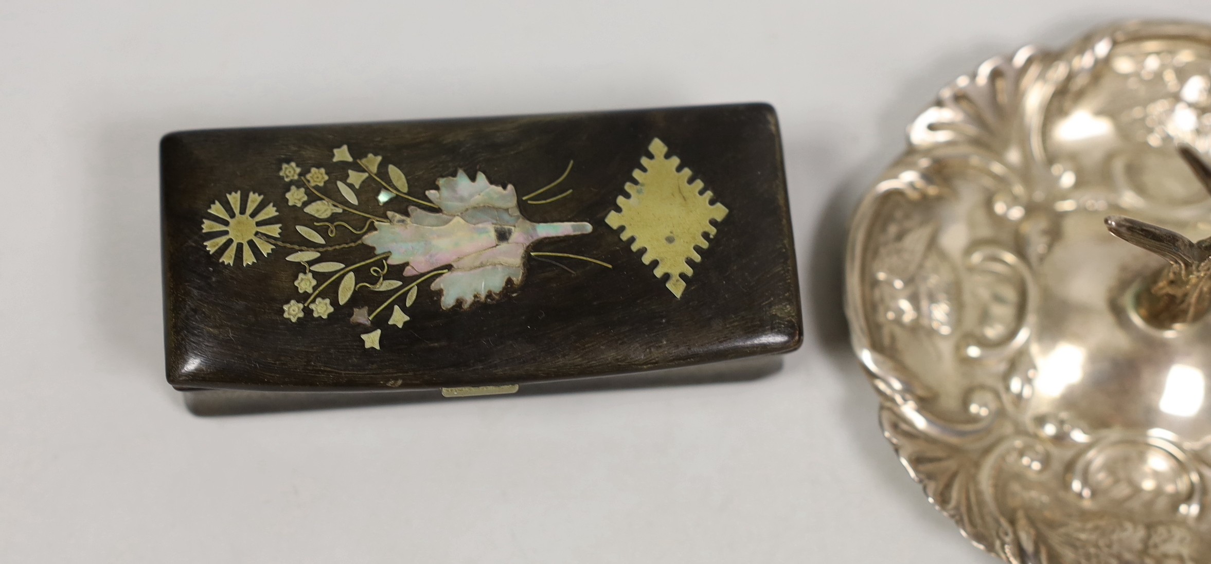 Two early 20th century silver ring stands, tallest 7cm, a small silver mounted trinket box and a 19th century inlaid wooden snuff box